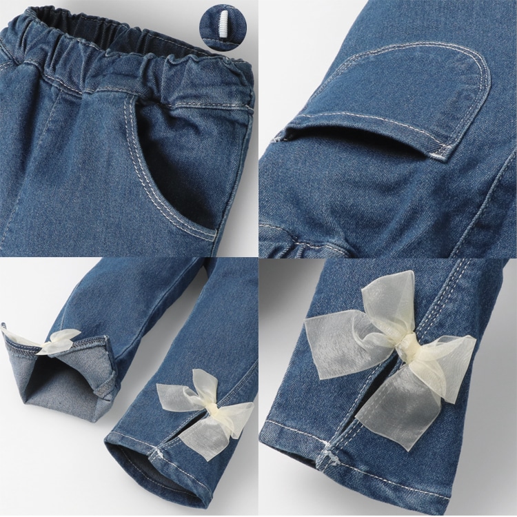 Stretch denim pants with ribbon and flower embroidery at hem