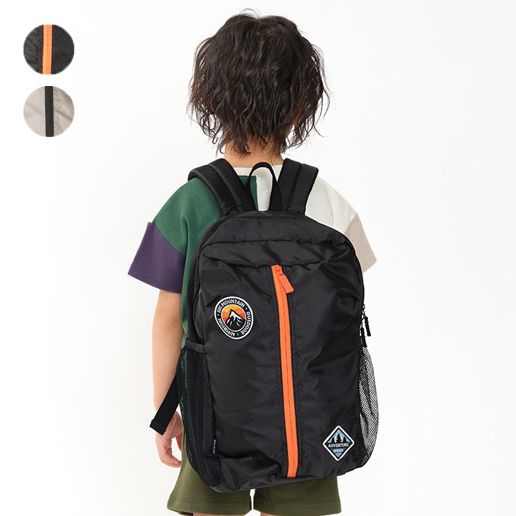 Water repellent oval backpack with patch